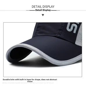 Detail view showing breathable gray mesh stitching and durable brim of blue baseball cap
