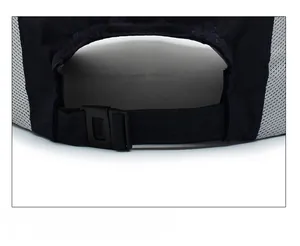 Detail of adjustable plastic strap and grey breathable mesh on a blue baseball cap