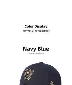 Detailed close-up of navy blue cotton baseball cap with intricate shield embroidery