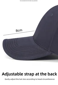 Detail showing adjustable metal buckle and 8cm brim on navy washed cotton baseball cap