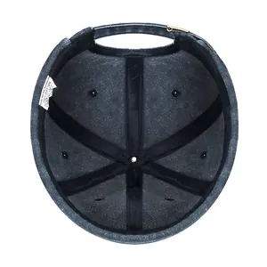 Internal view of a washed denim docker cap showing 100% cotton label and stitching