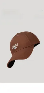 Detail view of the brown baseball cap featuring ear flaps and neck sun protection