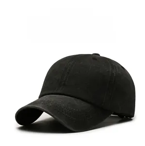 Close-up of black washed cotton baseball cap showing vintage texture and stitching details