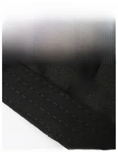 Macro detail of breathable widened sweatband inside a black cotton baseball cap