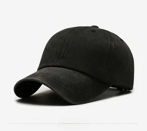 Detail view showing washed charcoal cotton fabric and 6-panel structure of the baseball cap