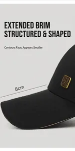 Detail view of high quality black baseball cap showing the 8cm extended brim and metal badge