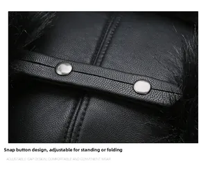 Detail of winter trapper hat showing leather texture and silver snap buttons on ear flaps