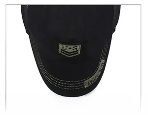 Detailed embroidery of US Army shield and lettering on the black cotton military cap brim