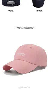 Detalle de gorra rosa de secado rápido con agujeros de ventilación láser y bordado
