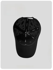 Detailed interior of black baseball cap featuring breathable mesh and reinforced YIMY branding