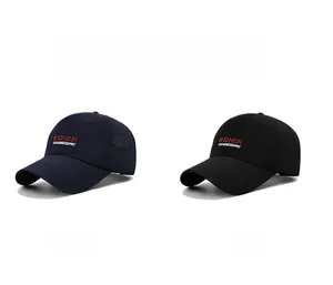 Detail view of navy blue and black baseball caps featuring premium letter embroidery