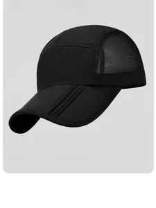Détail macro du tissu en maille respirante et des coutures renforcées sur la casquette noire