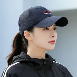 Navy blue quick-dry baseball cap with Chamonix embroidery shown on outdoor model