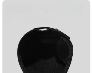 Detailed view of the warm fleece lining inside the black wool flat top cap for winter