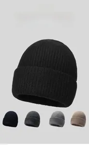 Macro view of high-density knitted texture and elastic cuff on a warm winter beanie