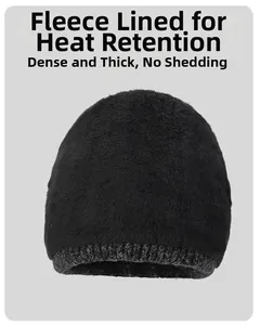 Close-up of thick fleece lining on black knit beanie for heat retention and warmth