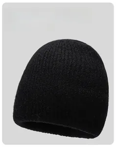 Detail of ribbed knit texture on black winter beanie with soft skin-friendly lining