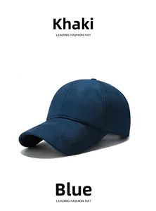 Close-up of deep blue sheepskin suede baseball cap showing fine texture and stitching