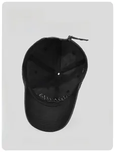 Detail view showing interior sweatband and 3D embroidery on black washed cotton baseball cap