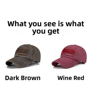 Close-up of vintage washed cotton baseball caps in dark brown and wine red colors
