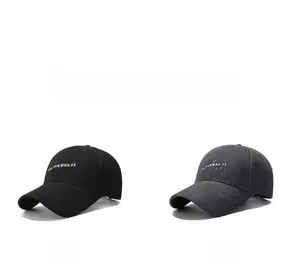 Detail view of black and grey baseball caps with CA embroidery and brand lettering
