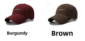 Detail showing high-quality letter embroidery on burgundy and brown baseball caps