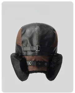 Detail of winter trapper hat featuring faux leather, warm fur lining and adjustable buckle