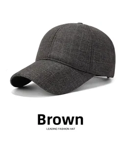 Detailed view of the brown plaid baseball cap featuring premium textured fabric blend