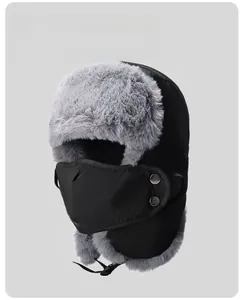 Detail of winter trapper hat with gray faux fur lining and windproof black fabric