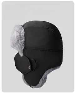 Close-up of windproof winter trapper hat with thick faux fur lining and detachable face mask