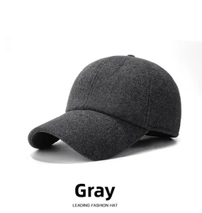 Detail of grey winter wool baseball cap showing thick textured fabric and stitching