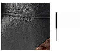 Detail of high-quality black lychee grain leather with durable stitching on winter aviator hat