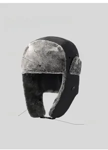 Detail of winter trapper hat showing plush faux fur lining and adjustable buckle strap