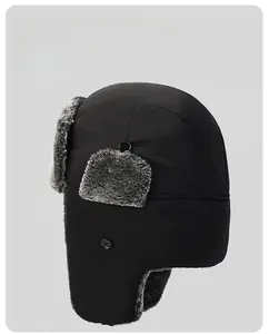 Detail of windproof black trapper hat featuring extended faux fur earflaps and warm lining