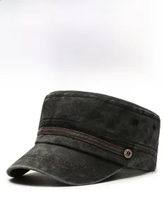 Close-up of vintage cotton flat top hat featuring decorative strap and gold metal button