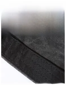 Detail of the widened sweatband inside a black cotton flat top hat with neat stitching
