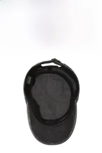 Detail of washed cotton flat top hat showing black sweatband and metal adjustment buckle