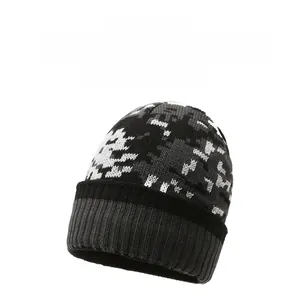 Detailed view of the winter knit beanie featuring gray camouflage patterns and ribbed cuff
