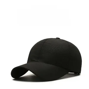 Close-up of black quick-dry baseball cap featuring breathable mesh fabric and mountain embroidery
