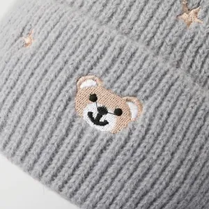 Kids grey knitted beanie hat with cute embroidered bear and golden stars detail