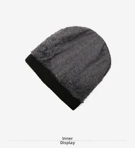 Close-up of thick dark grey fleece lining and black ribbed knit edge for winter hat