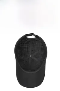 Detailed inner view of breathable laser-cut mesh holes on black quick-dry baseball cap