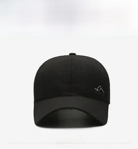 Detailed view of the breathable mesh fabric and mountain print logo on this black baseball cap