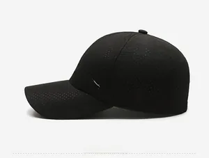 Detail of black breathable mesh fabric with white mountain peak icon and PAHODA CAP text