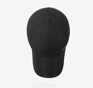 Top view of a black quick-dry baseball cap featuring breathable laser-cut perforation details