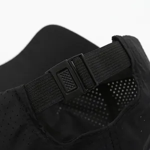 Rear view of black mesh baseball cap showing adjustable plastic buckle and breathable fabric