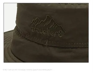 Détail de la broderie de montagne et du texte travellers sur chapeau de pêcheur