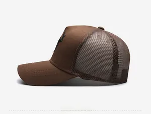 Side view of high-crown trucker hat featuring brown mesh and detailed deer embroidery