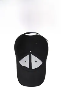 Inside view of black baseball cap showing white mesh reinforcement and breathable fabric