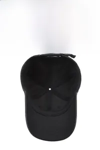 Detail of black cotton baseball cap showing internal six-panel structure and metal buckle